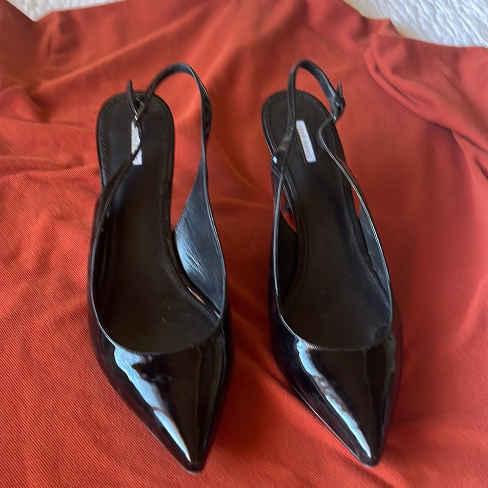 Vera Wang Black Patent leather 3” heels open with ankle strap.